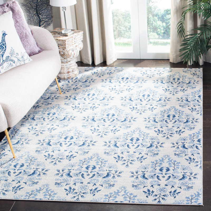 Blue and Cream Floral Synthetic 11' x 15' Area Rug