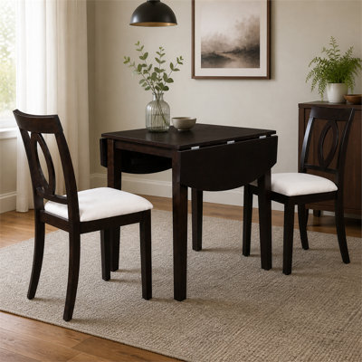This three-piece dining set includes a retractable folding table and two cushioned chairs. It is brown and suitable for small apartment kitchens, taki