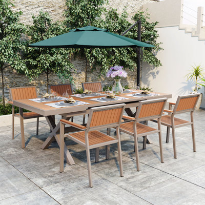 Experience Outdoor Dining Freedom With A Flexible Set Including Six Chairs And A Table by Corrigan Studio