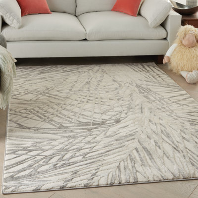 Tapis beige / gris à motif floral tissé à la machine