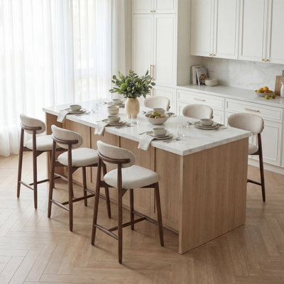 Tabouret de comptoir rembourrÃ© Solon avec structure en bois massif