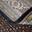 Losh Oriental Area Rug in Black