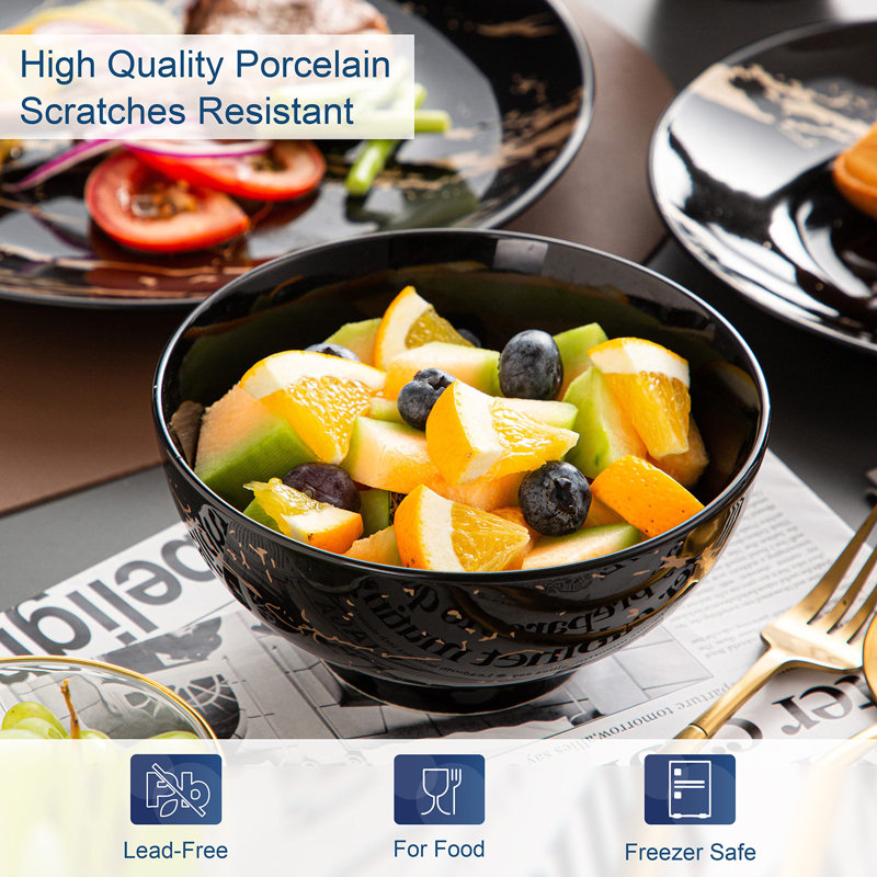 Black and Gold Splash Porcelain 16-Piece Dinnerware Set