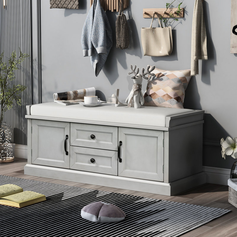 Banc de rangement à 2 tiroirs en gris délavé avec coussin de rangement.