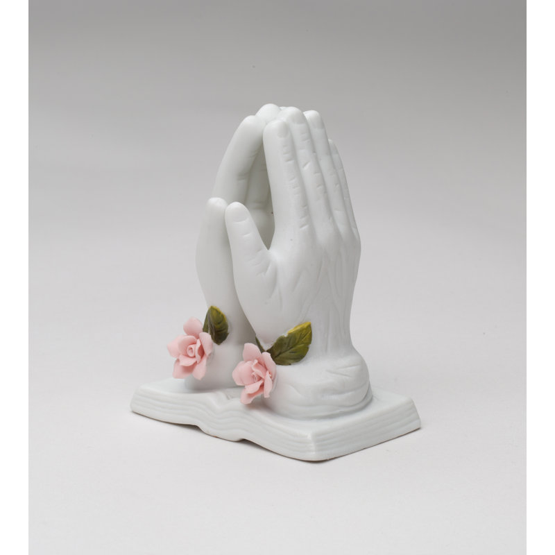 Figurine priant avec une rose