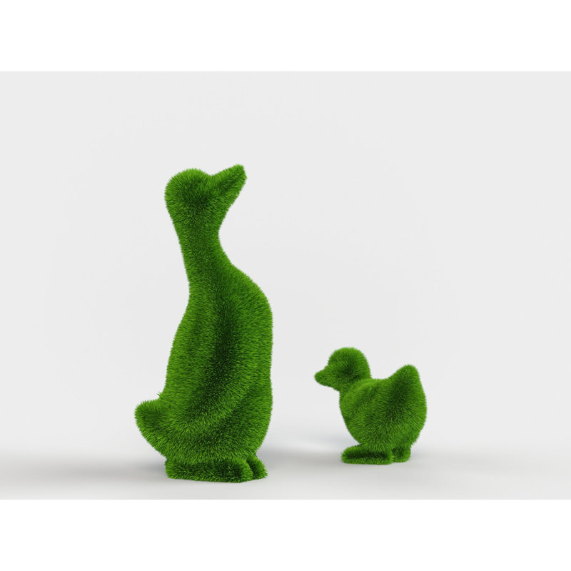 Personnage extérieur canard et topiaire vert