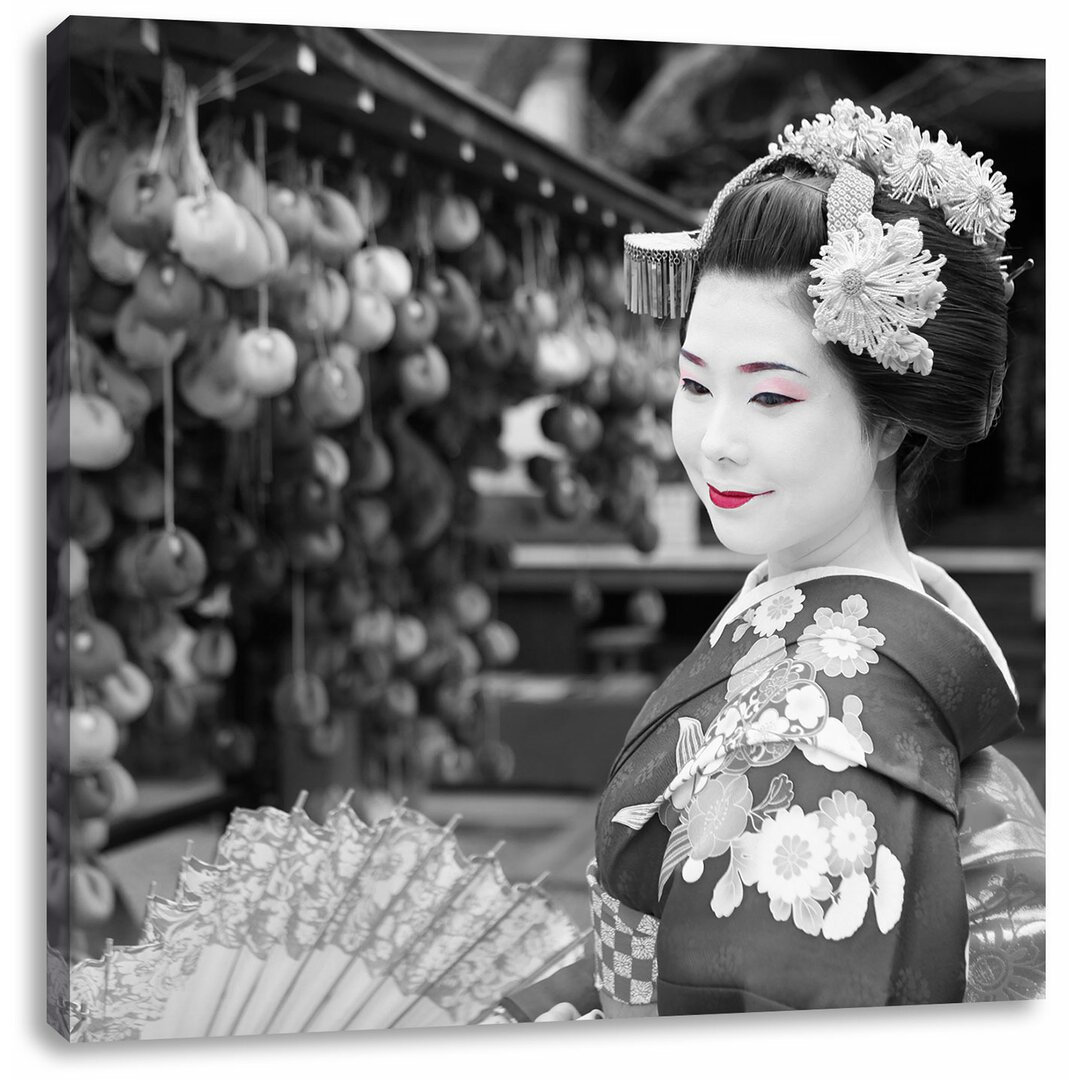 Leinwandbild Schöne Geisha mit Fächer