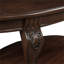 Table basse ovale à finition cerisier avec tablette ouverte, base en bois d'hévéa massif et plateau en panneau de fibres à densité moyenne de 42 pouces