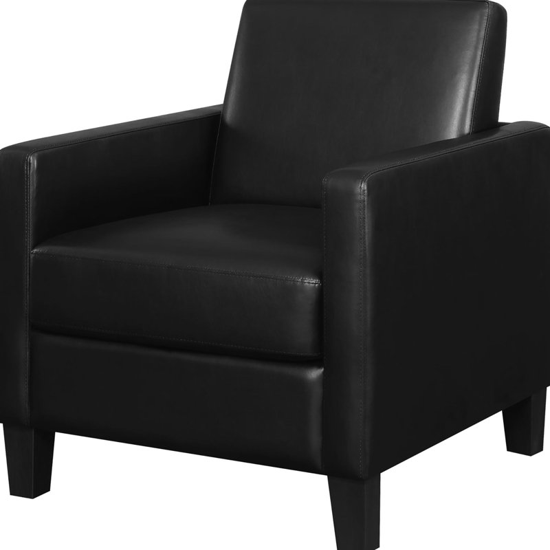 Chaise rembourrée noire avec de hauts pieds fuselés et un siège confortable à dossier amovible moderne