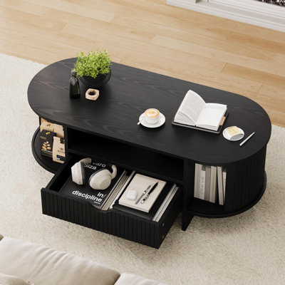 Table basse ovale de 47,2 po avec rangement, table centrale cannelée de style Mid-Century avec tiroir et portes d'armoire coulissantes, décoration de table basse d'appoint pour petit salon (noir)