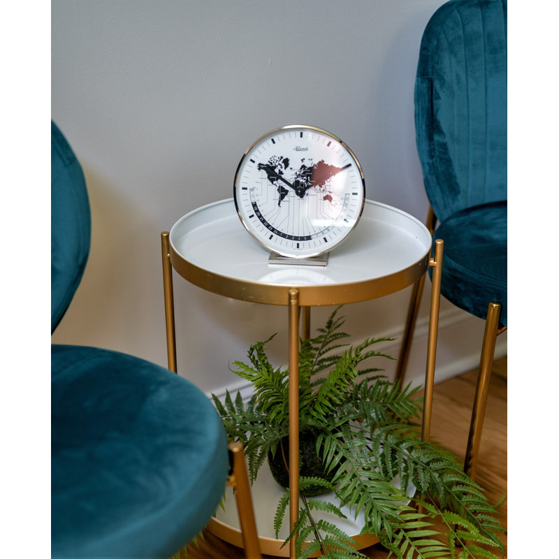 Nickel Plated Table Clock with a Quartz Time Only Movement   Dial features a world map and different time zones.