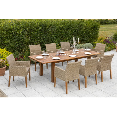 Harvir 8 - Person Patio Dining Set Rectangular Table with Cushions Included