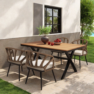 Ensemble repas d'extérieur avec 4 chaises en rotin et 1 table, structure en fer et coussins moelleux
