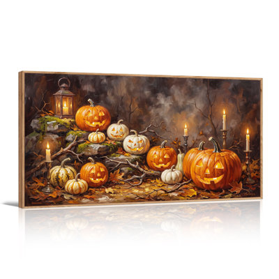 Art mural sur toile, citrouilles sculptées et bougies allumées dans la forêt sombre