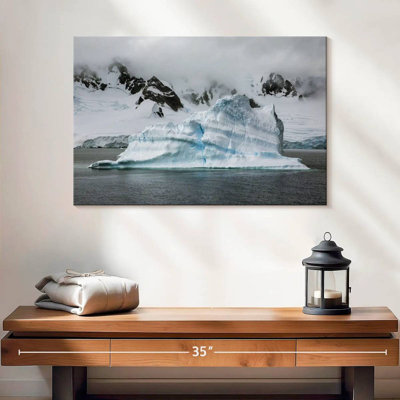 Iceberg With Mountain In Antarctica