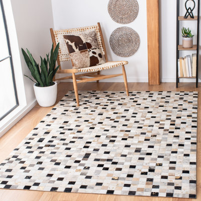 Tapis en cuir feutré à la main Herren ivoire / noir