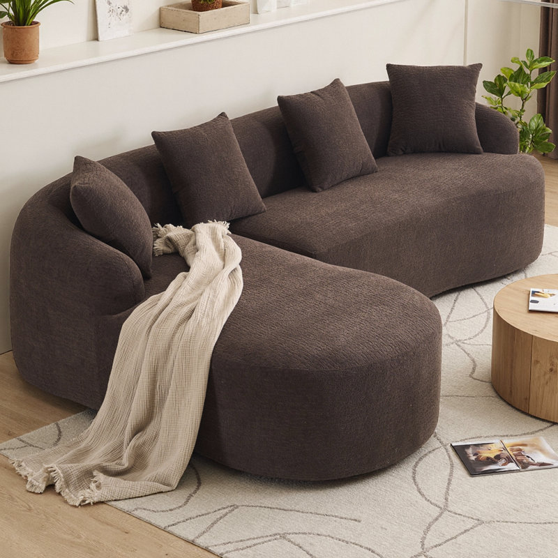 Canapé d'angle modulaire avec accoudoirs plus larges, assise plus profonde et dossier surélevé pour plus de confort et de style