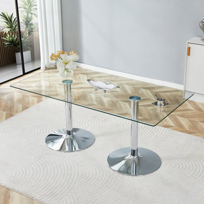 Un plateau de table en verre de 71 x 35,4 po et une table de salle à manger circulaire minimaliste moderne avec des pieds en métal argenté électrolytique. Convient aux restaurants et aux salons.