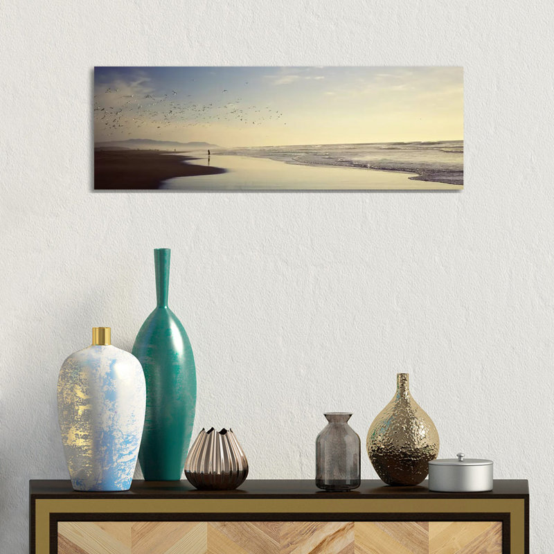 Flock Of Seagulls Flying Above A Woman On The Beach, San Francisco, California, USA - Wrapped Canvas Panoramic Print