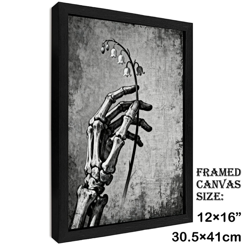 Art encadré noir tenant la fleur de cloche avec ses os à la main, impressions sur toile de style rétro, H 17 po x l 13 po