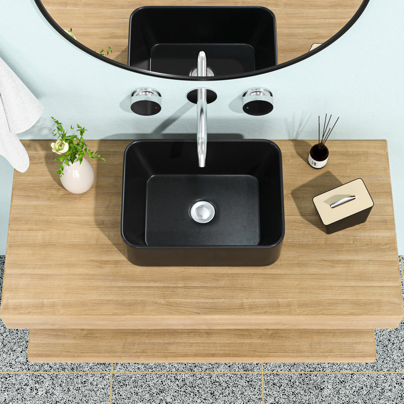 Lavabo de salle de bain vasque rectangulaire en céramique 16 po x 12 po en noir. Design moderne. Excellente qualité, faible capacité d'absorption d'eau. Surface de teinture. Fixation au-dessus du comptoir. Trou de drain central de 1 3/4 po. 16 x 12 po classique