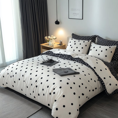Couette simple à pois noirs et blancs