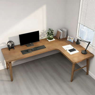 Bureau brun en bois massif en forme de L