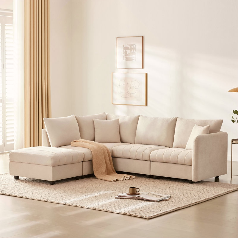 Canapé modulaire moderne 89 * 79 avec assise profonde, rayures verticales, repose-pieds mobile et coussins décoratifs pour un salon confortable