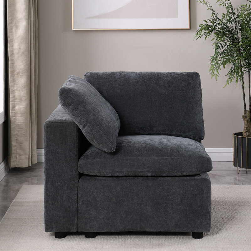 Fauteuil gauche modulaire en chenille gris - canapé confortable et moderne, faisant face à une expérience d'assise ferme