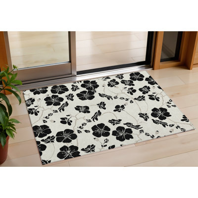 Tapis extérieur lavable floral ivoire et noir 3 pi x 5 pi