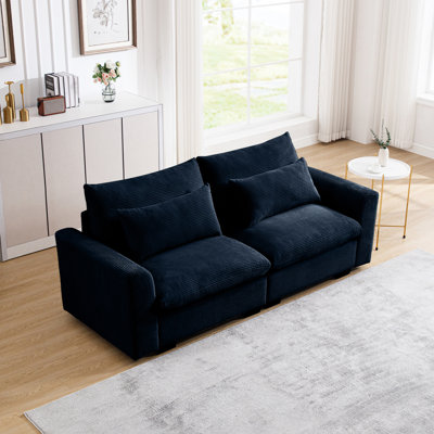 Accoudoir en velours côtelé 2 places bleu créant un salon élégant avec un tissu bleu pour