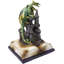 Figurine médiévale avec un dragon vert perché sur un château de DEL