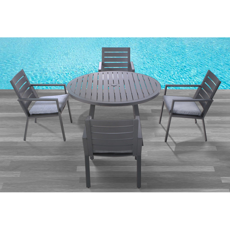Adelynn 4 - Person Patio Dining Set with Round Table , Cushions Included