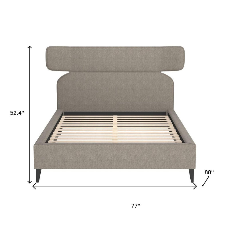 Structure de lit brun en bois massif et tissu d'ameublement
