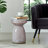 Iridescent Glass Accent Table with Artistic Design and Sturdy Base.