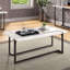 Table basse moderne de style contemporain avec pieds extensibles, plateau en laque ultrabrillante et structure en acier au fini bronze industriel