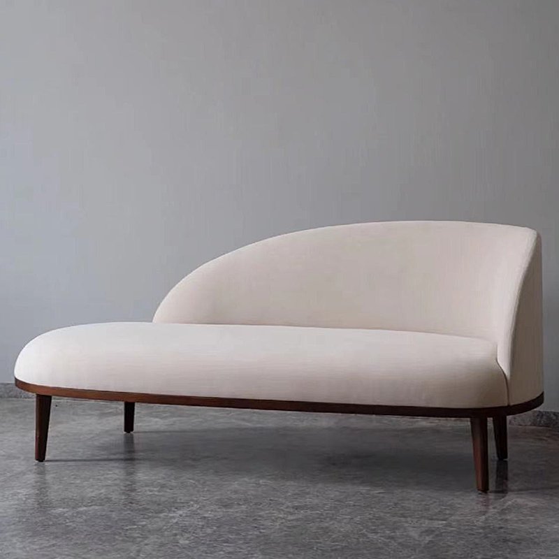 Chaise longue rembourrée en bois massif