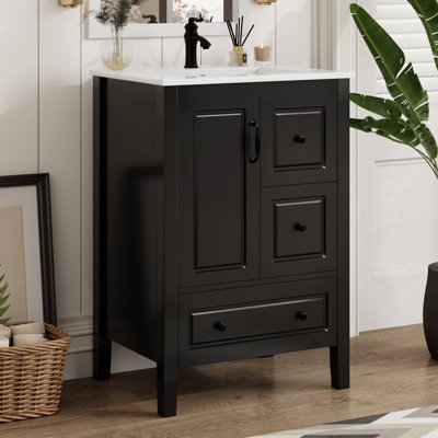 Meuble-lavabo autoportant noir de 24 po avec lavabo en céramique lisse, une porte à fermeture douce et 3 tiroirs pour articles de salle de bain
