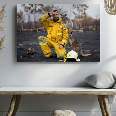 Canvas A Firefighter In A Bright Yellow Uniform Kneels On The Wall Art Blackened Earth His Weary Face Etched With Sorrow As He For Canvas Wall Art