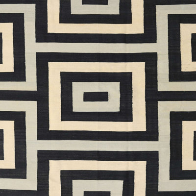 Tapis géométrique noir / beige
