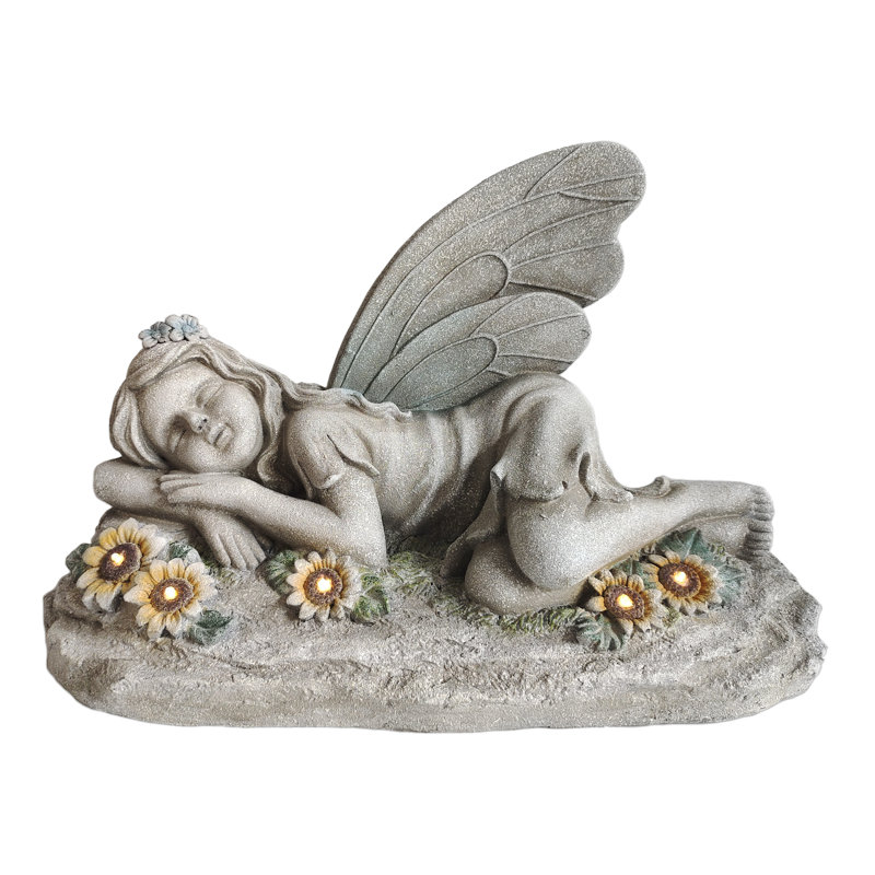 Statue solaire ange endormi avec fleurs