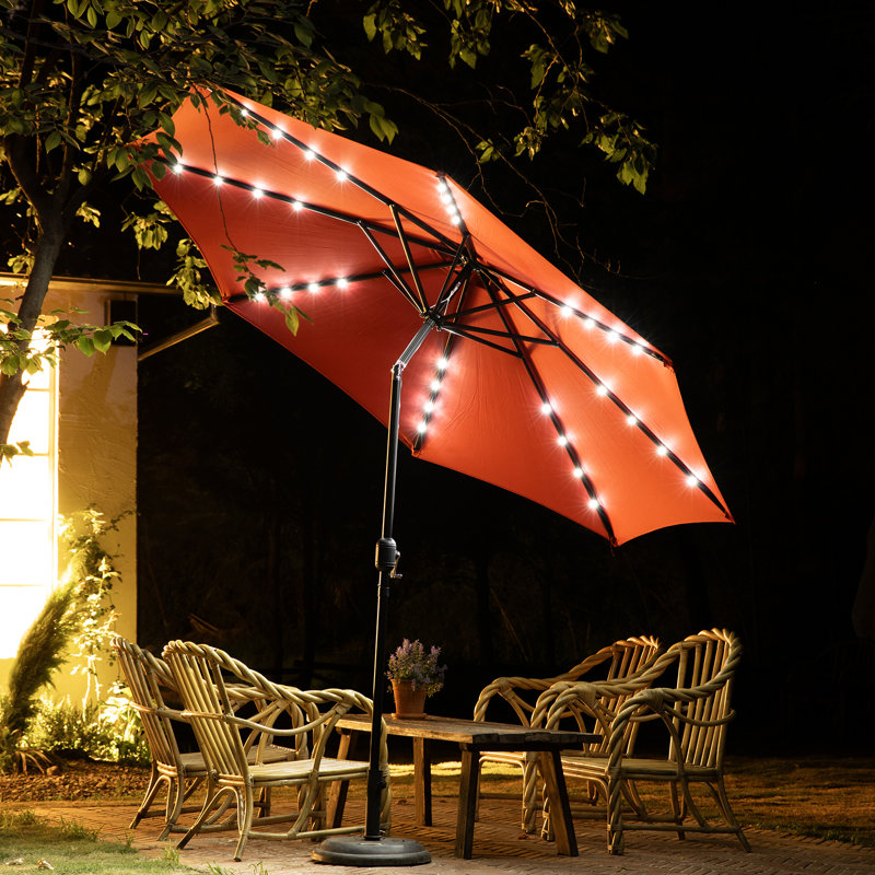 Arlmont & Co. 10ft Solar Polyester 32 LED Lighted Patio Umbrella with Tilt  Adjustment and UV-Resistant Fabric | Wayfair