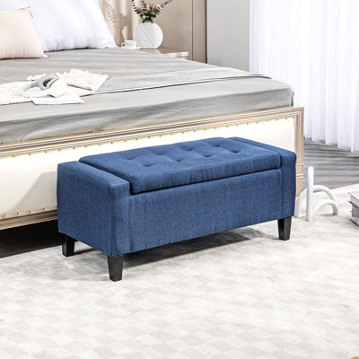 Banc de rangement avec repose-pieds en lin et capitonnage bleu foncé pour le salon