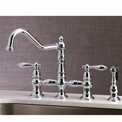 Kingston Brass Restoration Two-Handle 4-Hole Deck Mount Bridge Kitchen Faucet with Brass Side Sprayer