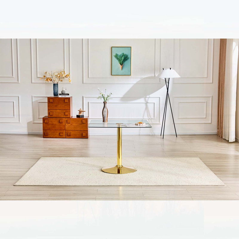 Table de salle à manger minimaliste avec base en métal à colonne unique, idéale pour les espaces compacts et une utilisation polyvalente.