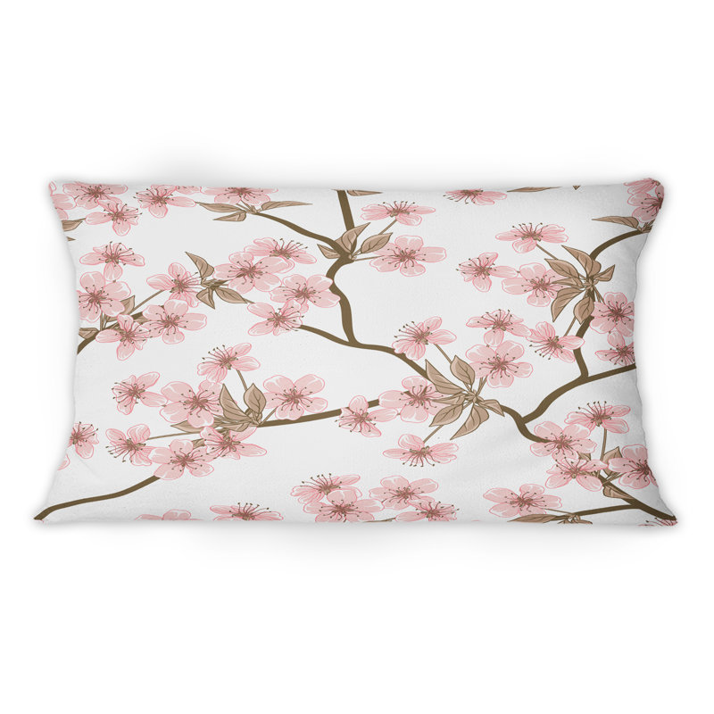 Coussin décoratif à motif de cerisiers roses en fleurs sur fond blanc