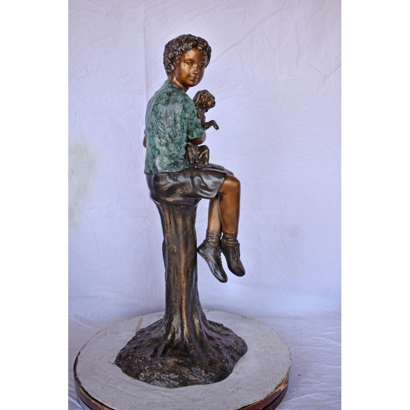 Boy Sitting On A Log With His Puppy Bronze Statue - Size: 15"L X 15"W X 35"H.