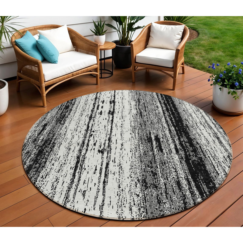 Tapis intérieur / extérieur rond rayé noir et ivoire 8 pi
