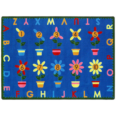 Tapis éducatif avec poussoirs de pétales par Joy