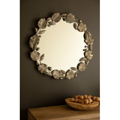 ROUND RUSTIC FRAMED MIRROR WITH LEAF DETAIL
